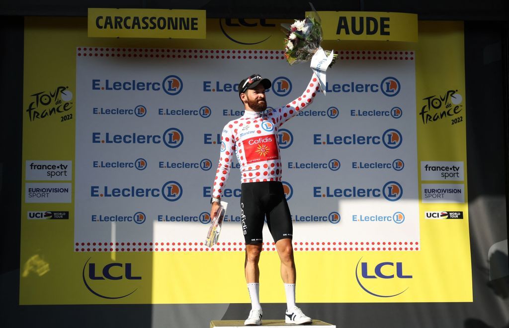 Cofidis teams German rider Simon Geschke celebrates on the podium with the climbers dotted jersey after the 15th stage of the 109th edition of the Tour de France cycling race 2025 km between Rodez and Carcassonne in southern France on July 17 2022 Photo by Thomas SAMSON AFP Photo by THOMAS SAMSONAFP via Getty Images