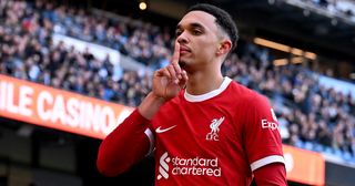 Trent Alexander-Arnold of Liverpool celebrates after scoring the equalising goal during the Premier League match between Manchester City and Liverpool FC at Etihad Stadium on November 25, 2023 in Manchester, England.