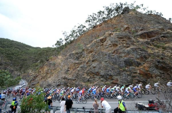The peloton climbs in the shadow of Australia's magnificent scenery