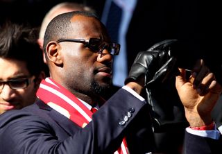 LeBron James watches Liverpool take on Manchester United in October 2011.