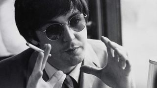 Photo of Paul McCARTNEY and BEATLES; Paul McCartney, posed, wearing sunglasses, holding cigarette, during interview (Photo by Fiona Adams/Redferns)