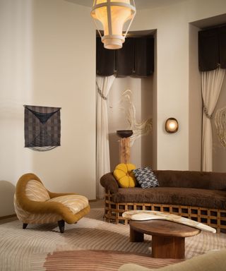 A living room with a brown sofa, yellow and white armchair, and tall curtains