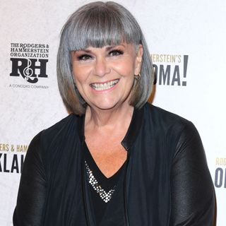 Dawn French smiles against a monochrome backdrop