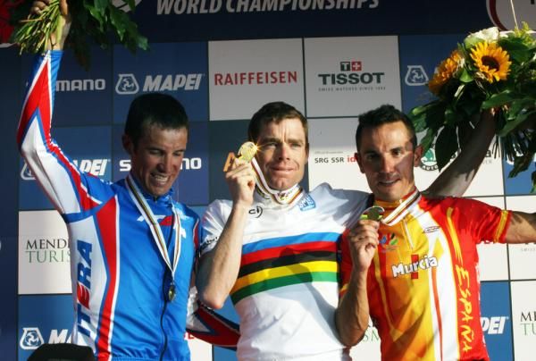 Cadel Evans' medal glints in the evening sun.