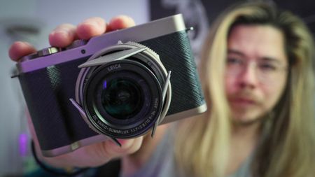 James Artaius holding a Panasonic Lumix L10