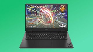 HP OMEN 17 gaming laptop on a green background.