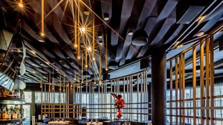 Loudspeakers and subwoofers from DAS Audio hang in a Miami high-end steakhouse.