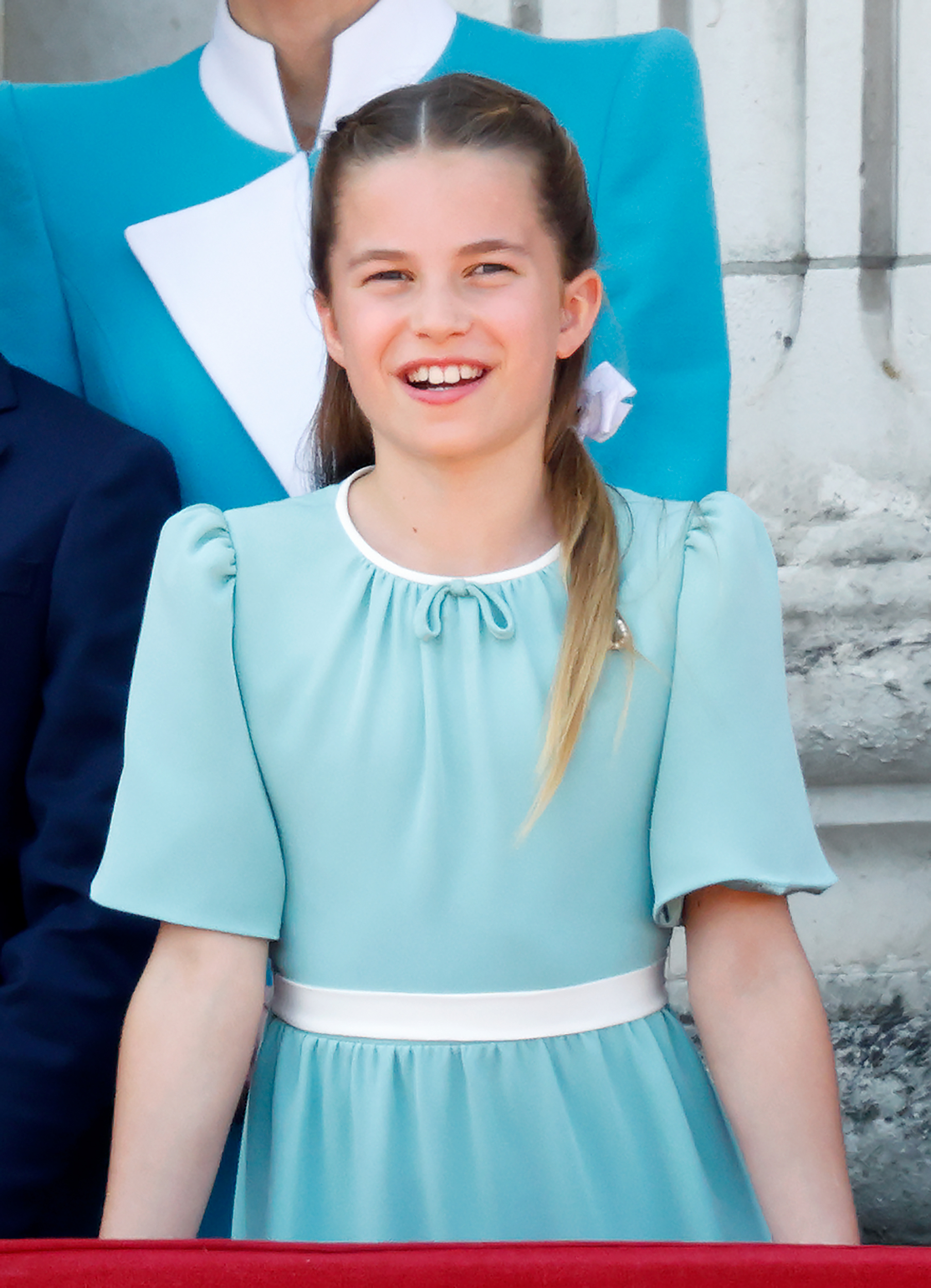 Princess Charlotte in a turquoise dress smiling