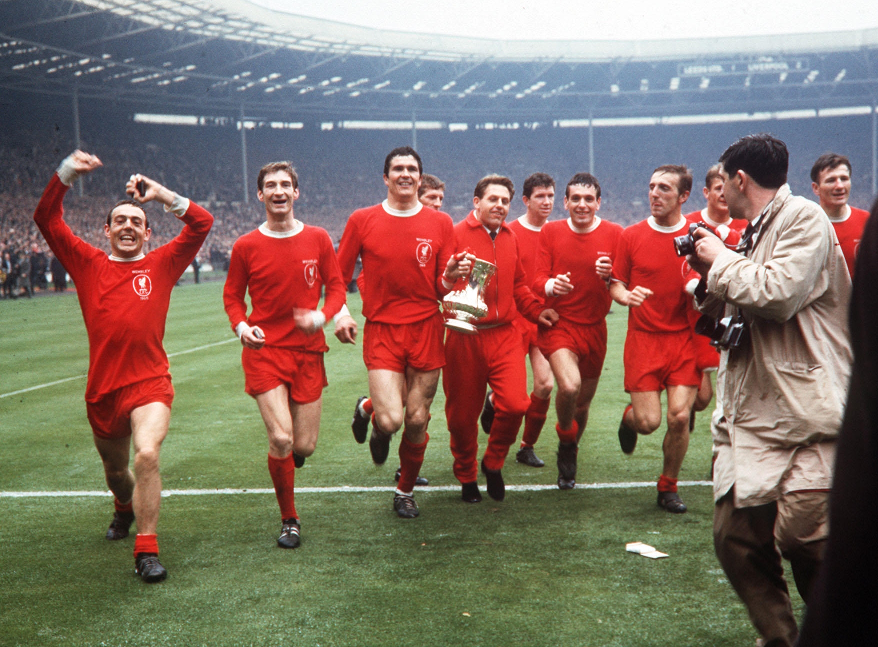 Liverpool players celebrate with the trophy after winning the 1965 FA Cup final against Leeds at Wembley