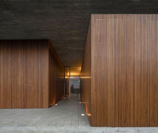 The sleeping areas are enveloped in timber screens