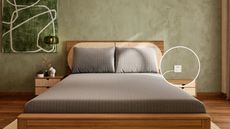 Gray sheets on a brown bed base against green walls with green wall art.