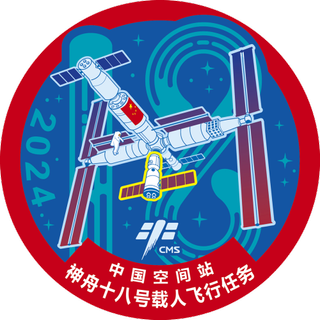 a patch covered in Chinese writing depicting a cross-shaped space station