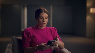 Coleen Rooney seen looking at her phone in new documentary