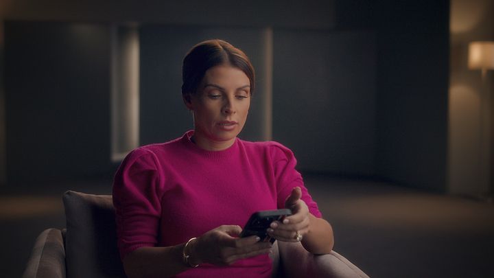 Coleen Rooney seen looking at her phone in new documentary