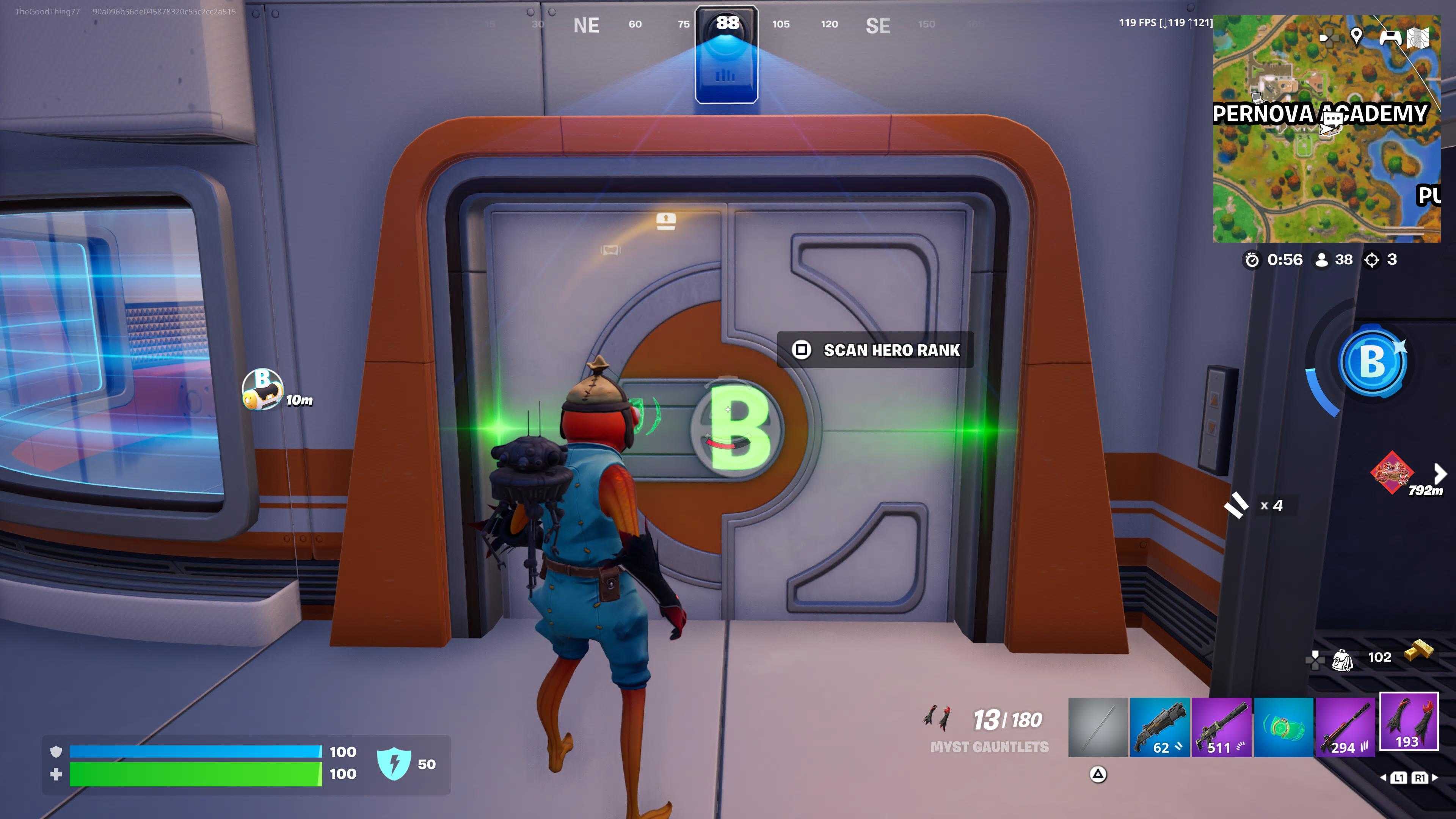 Fish Stick stands in front of a white and orange laboratory door with "B" projected over it.