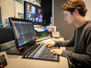 A student uses an audio solution from Solid State Logic at Emerson.