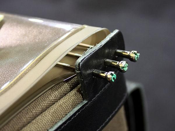 The "water-resistant" cotton canvas and leather construction is even accented with real spokes and nipples to help secure the map holder.