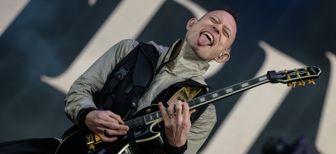 Matt Heafy sticking his tongue out on stage