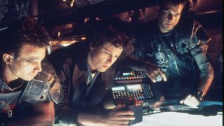 Ellen Ripley (Sigourney Weaver) with her crew in Aliens.