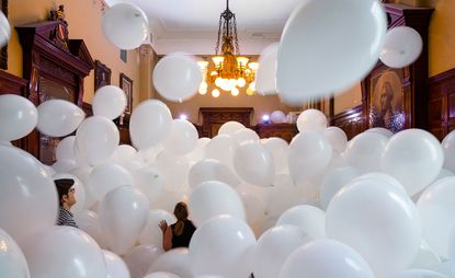 historic period rooms is stuffed with large white balloons
