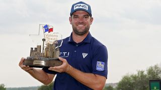 Corey Conners with the trophy after his second win at the Valero Texas Open
