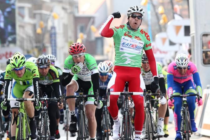 Alexander Kristoff (Katusha), wearing the points jersey, celebrates victory in stage 3 at De Panne.