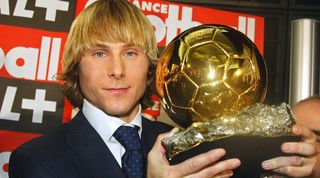 PARIS, FRANCE: Juventus midfielder Pavel Nedved poses, 22 December 2003 in Paris, with the Ballon d'Or, prize handed out by bi-weekly France Football magazine for the 2003 European Footballer of the Year. Nedved captained Czech Republic to the Euro 2004 finals in Portugal and last season led Juventus to the Champions League final, where they lost to AC Milan on penalties, though he was suspended for that match at Old Trafford. AFP PHOTO PIERRE VERDY (Photo credit should read PIERRE VERDY/AFP via Getty Images)