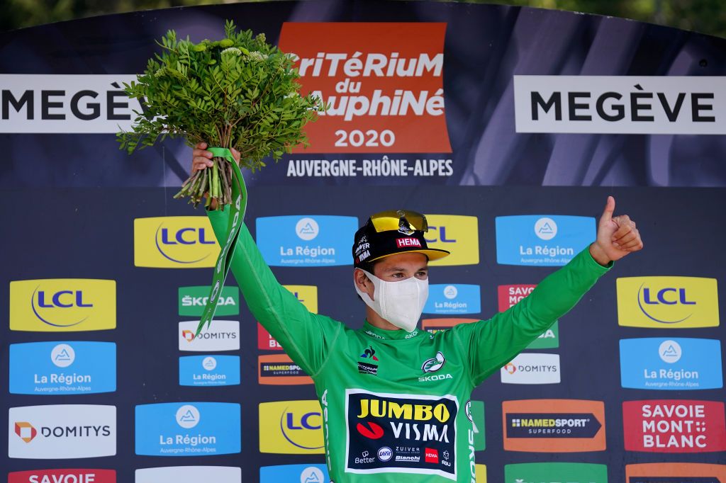 MEGEVE FRANCE AUGUST 15 Podium Primoz Roglic of Slovenia and Team Jumbo Visma Green Points Jersey Celebration Flowers Covid safety measures during the 72nd Criterium du Dauphine 2020 Stage 4 a 1533km stage from Ugine to Megeve 1458m dauphine Dauphin on August 15 2020 in Megeve France Photo by Eddy LemaistrePool via Getty Images