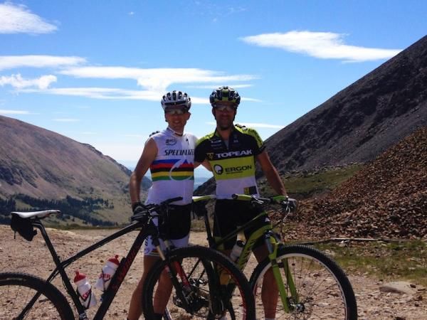 Current marathon world champion Christoph Sauser and former marathon world champion Alban Lakata pose for a photo on their way up Mosquito pass.