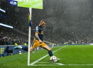 Kieran Trippier of Newcastle United (15) takes a corner kick in torrential rain during the Premier League match between Tottenham Hotspur and Newcastle United at Tottenham Hotspur Stadium on October 23, 2022 in London, England.