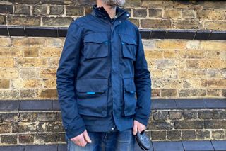 Male cyclist wearing the Altura Grid Field Jacket which is one of the best commuter cycling jackets