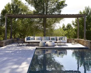 pool and gazebo with patio and furniture