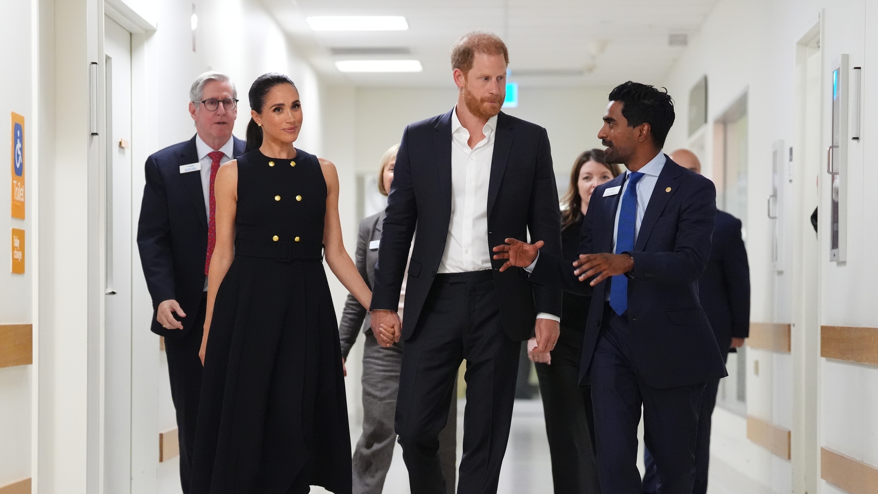 Meghan, Duchess of Sussex and Prince Harry talk with Kog Ravindran, chief of staff to the CEO &amp;amp; executive director of communications at the Royal Children's Hospital, during a visit on April 14, 2026