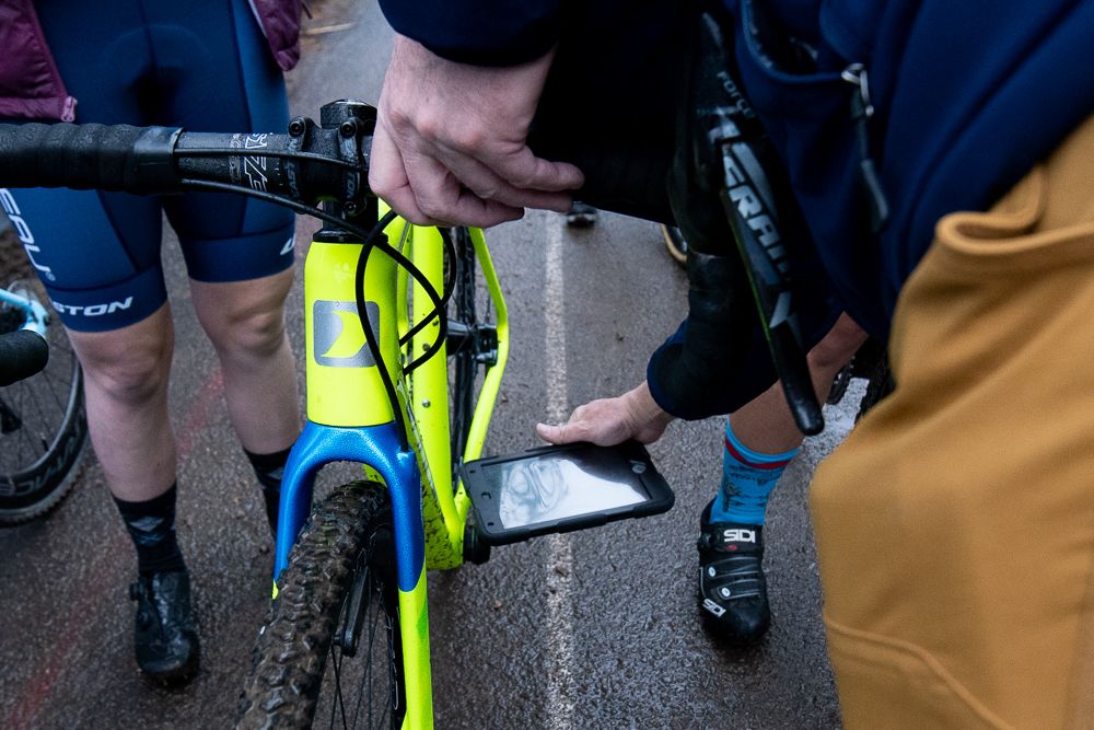 A USA Cycling official checks for motors on the start line