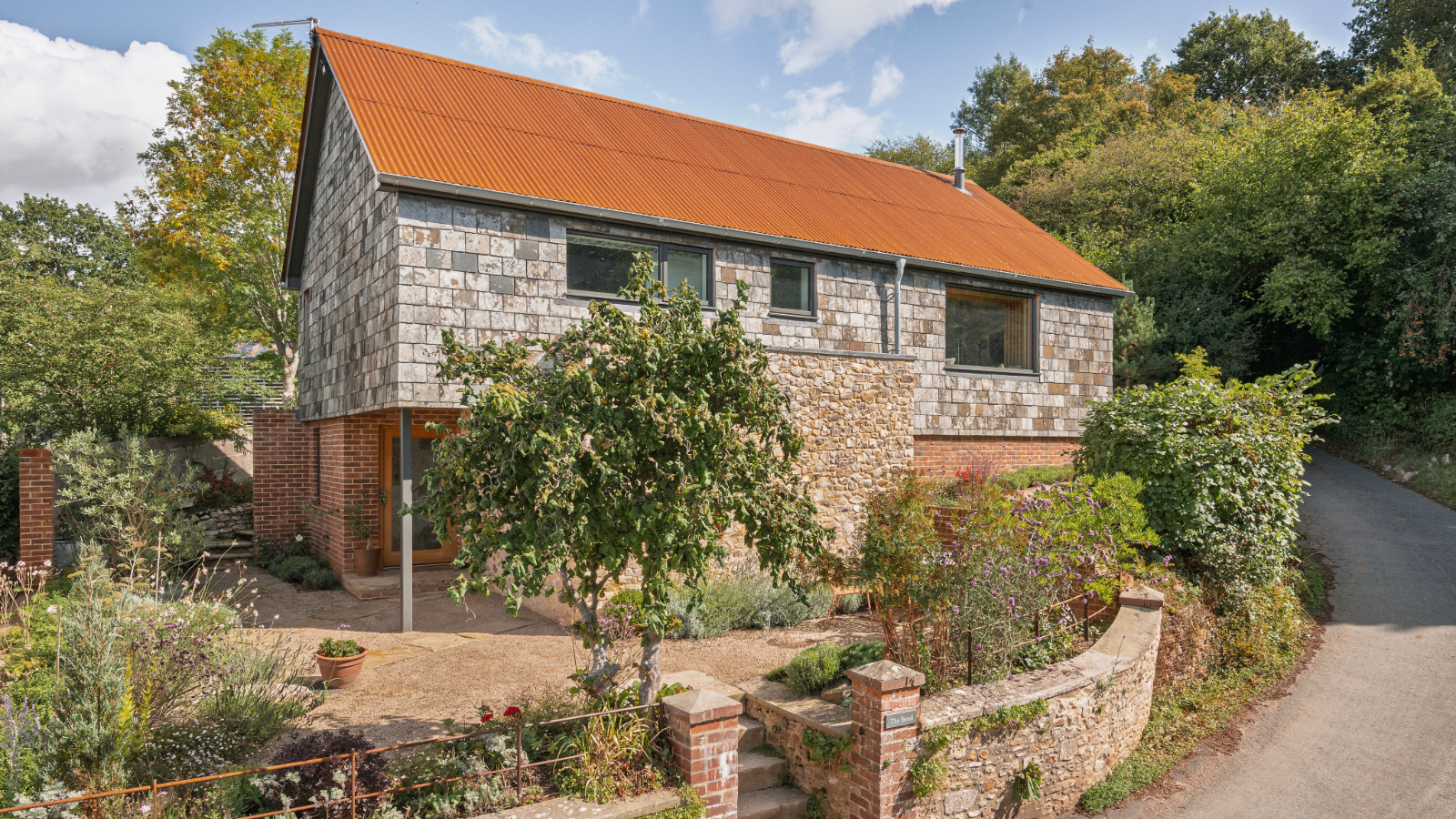 Exterior of the property which is on a bendy road