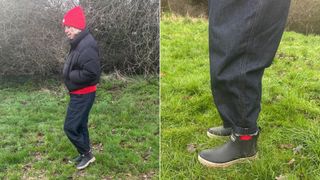 A blonde haired woman walks through grass wearing Barbour Mallow welly boots