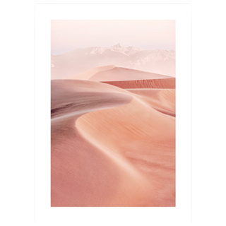 An art print featuring a peach and pink toned photograph of sand dunes