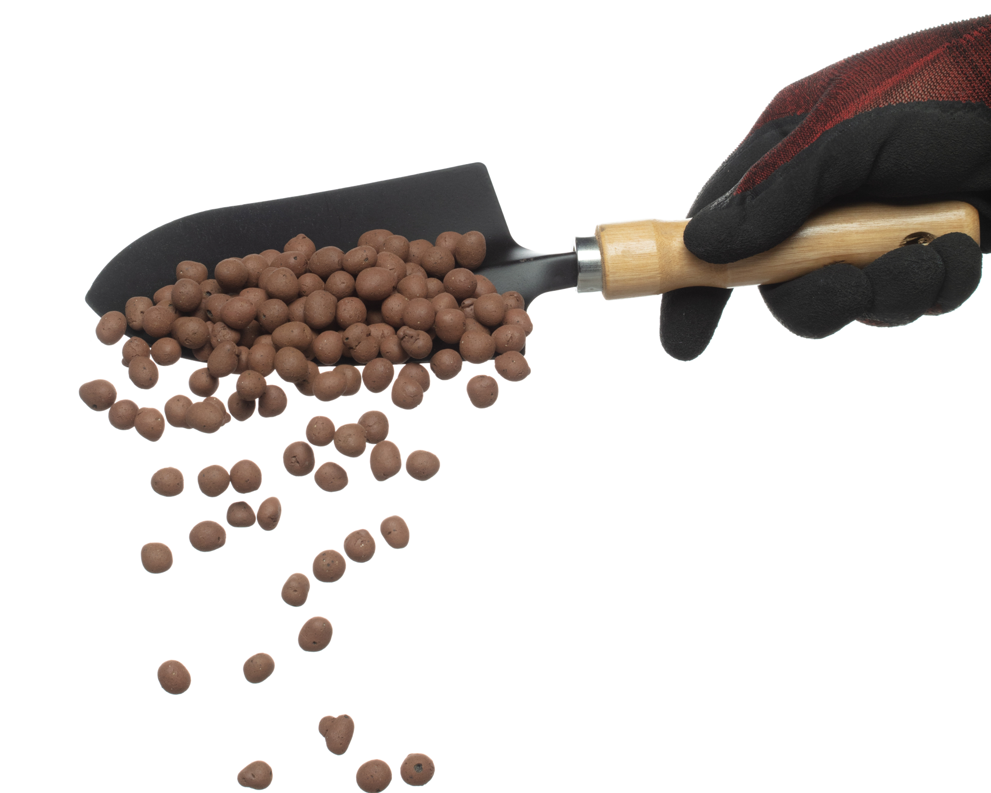 gloved hand holding trowel of LECA clay pebbles