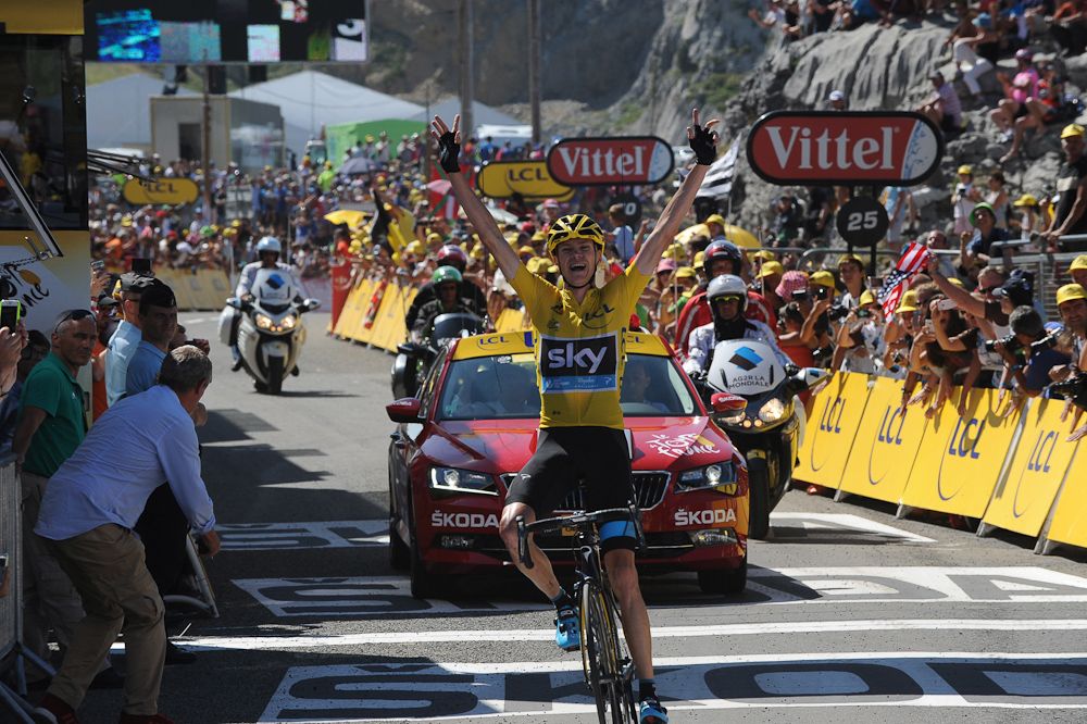 Chris Froome crosses the line to take the stage 10 win and extend his overall lead.