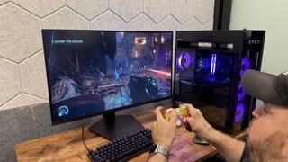 A person playing Doom: The Dark Ages on the Samsung Odyssey G8 (G80HS) gaming monitor