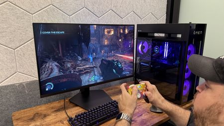 A person playing Doom: The Dark Ages on the Samsung Odyssey G8 (G80HS) gaming monitor