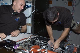 Mike Hopkins and Luca Parmitano Change Valve on ISS