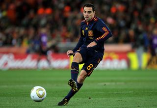 Xavi on the ball for Spain in the 2010 World Cup final against the Netherlands.