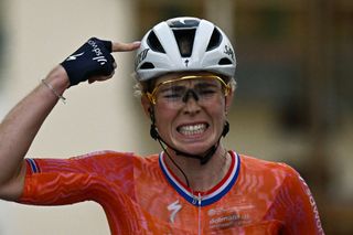 Team SD Worx - Protime's Dutch rider Demi Vollering reacts after crossing the finish line and wining the 8th and last stage of the third edition of the Women's Tour de France cycling race, a 149.9 km between Le Grand Bornand and the Alpe d'Huez, in south-eastern France, on August 18, 2024. (Photo by JULIEN DE ROSA / AFP)