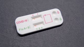 A dual combined antigen test for COVID-19 and the flu sitting on a table