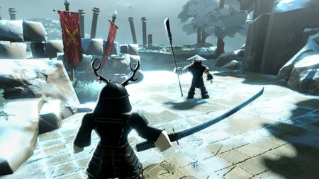 Two players battle on a snowy arena in Dueling Grounds.