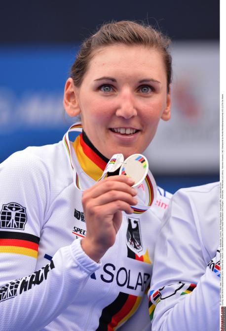 Lisa Brennauer (Germany) shows her silver medal off to the crowds