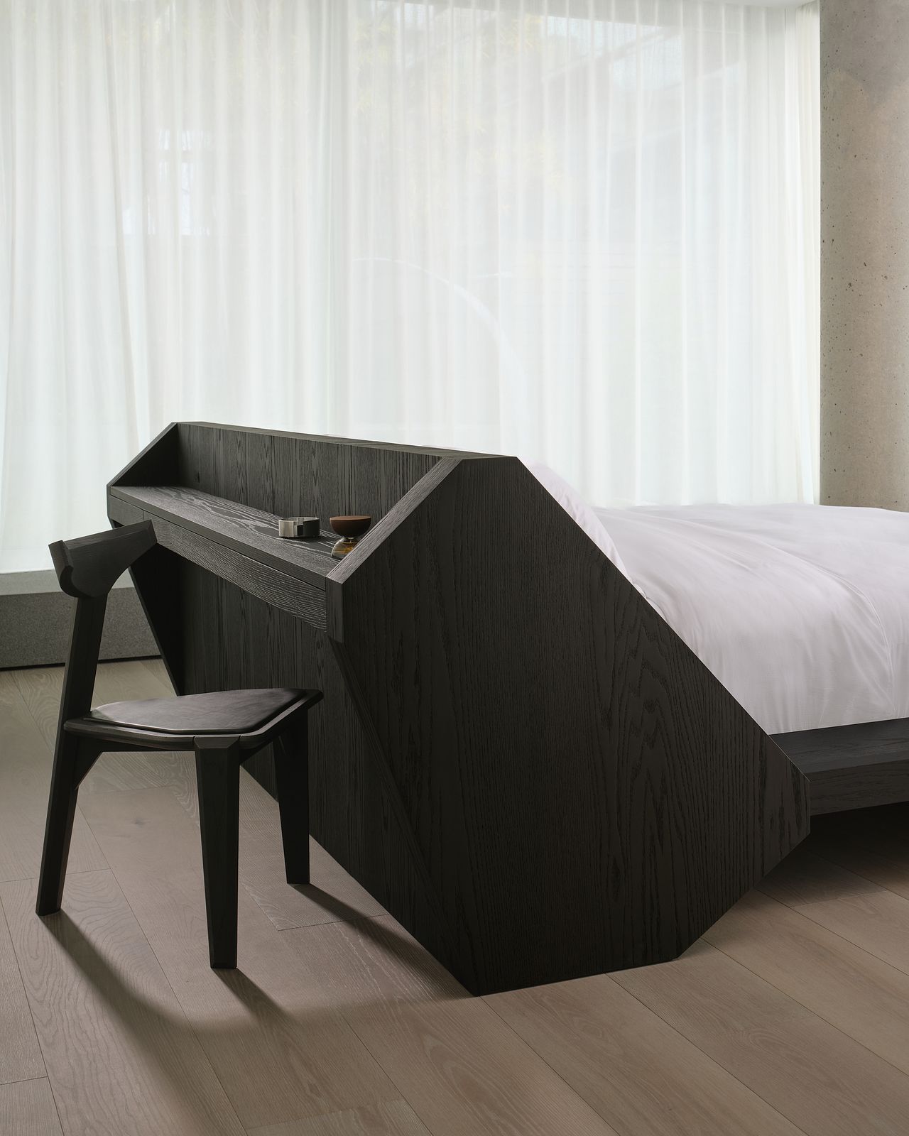 modern bedroom with large timber bedframe with built-in desk and chair