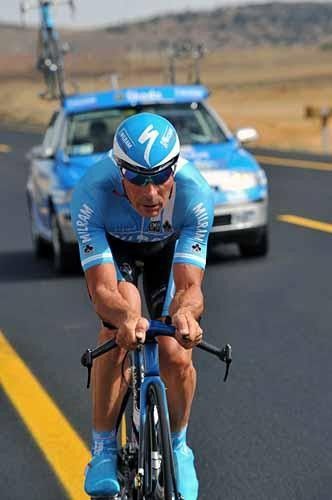 Erik Zabel is stalked by the Milram team car.