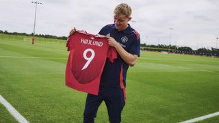 Rasmus Hojlund poses with his new No.9 shirt number at Manchester United